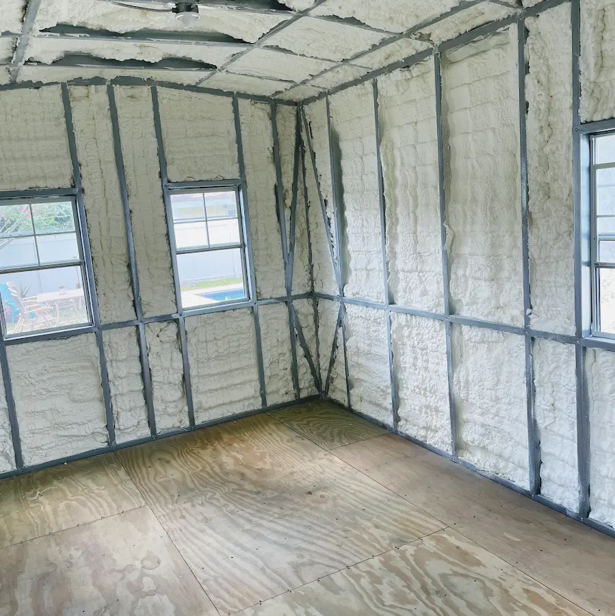 Closed-cell spray foam insulation applied to wall cavities in a residential project in Clay